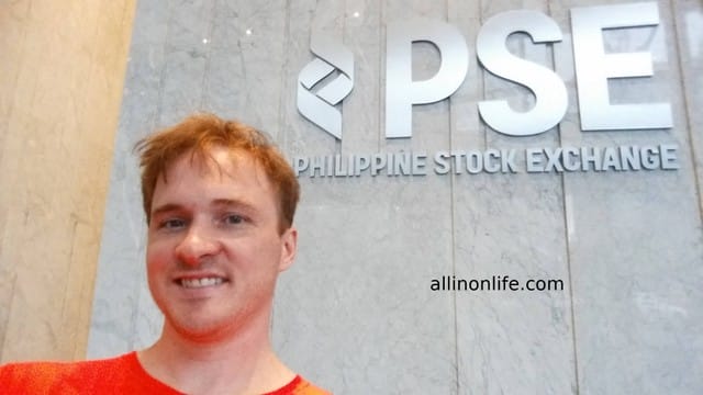 Selfie with Philippine Stock Exchange sign.